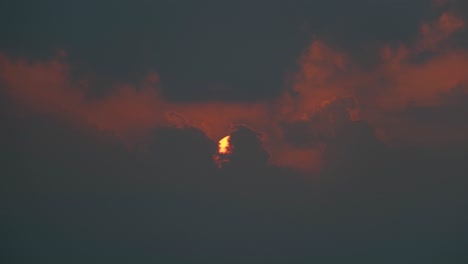 Sun-rises-through-dark-clouds-at-morning