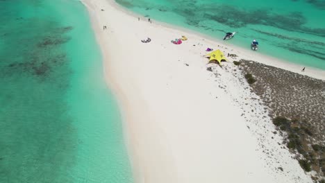 Aerial-reveal-of-kite-surfers-based-at-isthmus-and-island-of-Cayo-De-Agua