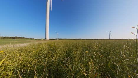 Slow-Motion-Wind-Farm-Turbine-in-the-Agricultural-Fields-on-a-Sunny-Summer-Day