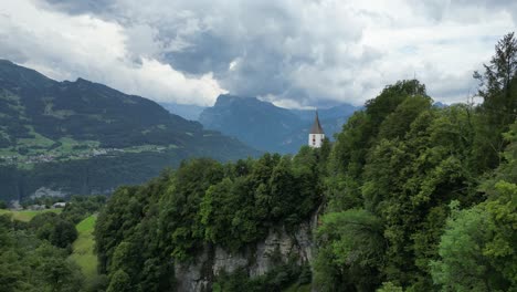 Fairytale-like-scene-of-church-tower-nestled-in-beautiful-Alpine-landscape