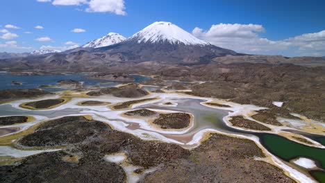 Aerial-view-over-of-Cotacotani-Lagoon,-Lauca-National-Park-in-Chile---rising,-drone-shot