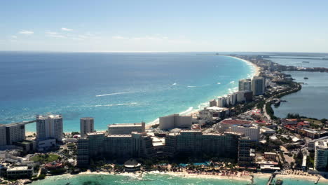 Coastal-skyline-of-Cancún-city-with-buildings-and-blue-sea-in-sunlight