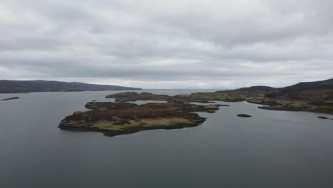 Drone-shot-of-Loch-Dunvegan,-a-beautiful-sea-loch-on-the-west-coast-of-the-island-of-Skye-in-the-Inner-Hebrides-of-Scotland