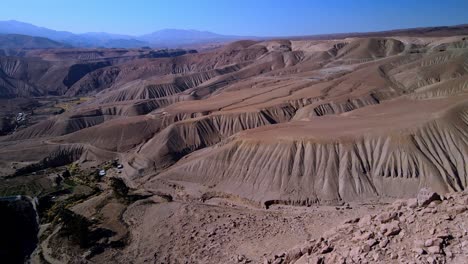 Aerial-view-of-a-village-in-Atacama-desert,-Chile---forward,-drone-shot