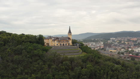Větruše-hill-with-chateau-hotel-above-Ústí-nad-Labem-city,-Czechia