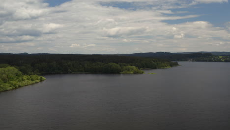 Green-shore-with-trees-along-Lipno-water-reservoir-in-Czechia