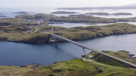 Advancing-drone-shot-of-the-bridge-connecting-Scalpay-to-the-Isle-of-Harris,-part-of-the-Outer-Hebrides-of-Scotland