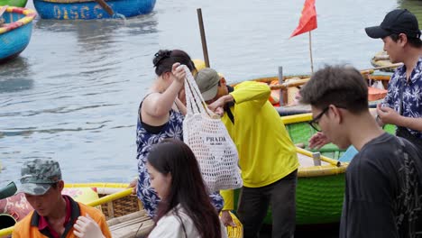 A-beautiful-lady-steps-out-from-basket-boat-after-enjoying-the-trip-on-the-river