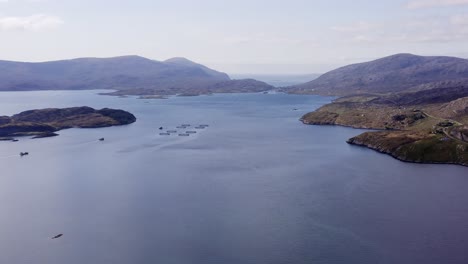 Wide-drone-shot-of-the-bay-around-Tarbert,-a-village-on-the-Isle-of-Harris,-part-of-the-Outer-Hebrides-of-Scotland