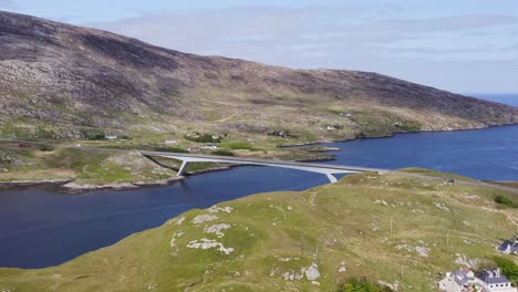 Ascending-drone-shot-of-the-bridge-connecting-Scalpay-to-the-Isle-of-Harris,-part-of-the-Outer-Hebrides-of-Scotland