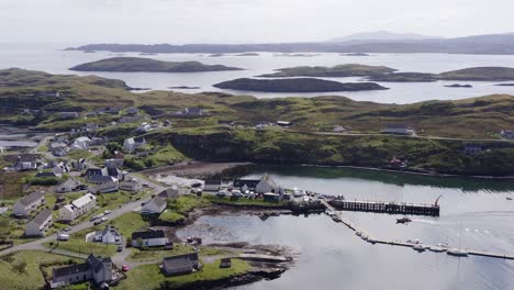 Aerial-shot-circling-the-village-on-the-Isle-of-Scalpay,-an-island-near-the-Isles-of-Harris-and-Lewis-on-the-Outer-Hebrides-of-Scotland