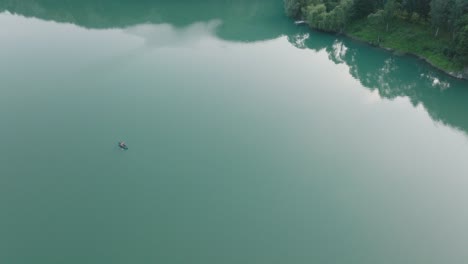 Idyllic-View-Of-Lake-Paltinul-With-Person-Kayaking-On-Doftana-River-In-Prahova-County,-Romania