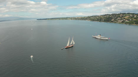 Circling-aerial-shot-around-a-sail-boat-to-reveal-Geneva-city