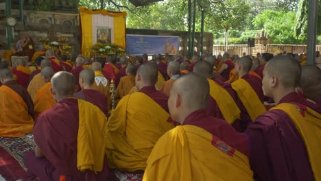 Monks-assembly-to-celebrate-the-Holy-Dalai-Lama's-88th-birthday-at-the-sacred-Mahabodhi-Temple-Complex-under-Banyan-tree