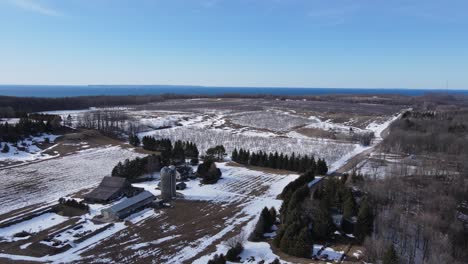 Farmstead-in-Leelanau-county-Michigan-with-huge-tree-orchard,-aerial-drone-view