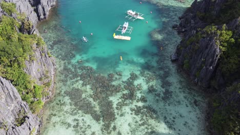 Small-lagoon-on-Miniloc-Island,-El-Nido,-Philippines,-Drone-shot