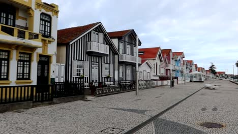 Cobbled-path-in-front-of-typical-colorful-houses-of-Costa-Nova,-Portugal