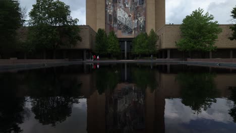 Touchdown-Jesus-building-on-the-campus-of-Notre-Dame-University-in-South-Bend,-Indiana-with-timelapse-video-tilting-up