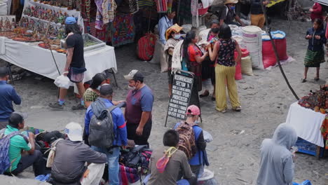 People-enjoy-busy-day-shopping-at-street-market-in-Antigua,-Guatemala