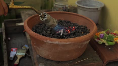 Annealing-silver-on-charcoal-with-propane-torch-for-jewelry-making