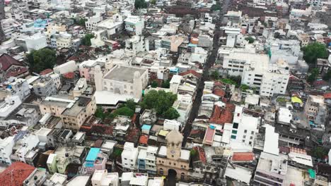 Aerial-view-of-the-very-narrow-lanes-of-Rajkot-showing-old-thatched-houses,-paved-houses-and-all-around
