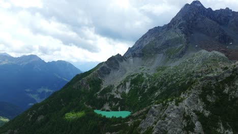 Hidden-beautiful-small-mountain-Lake-Lagazzuolo-in-Valtellina-during-summer-season,-Italy