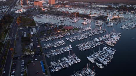 Bird-eye-view-drone-shot-yachts-docked-at-marina-on-coast-of-America