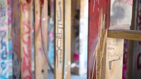 Camera-Rack-Focus-to-a-Childish-Drawing-inside-an-Abandoned-Graffiti-Vandalized-building-near-Canmore-Alberta-Canada