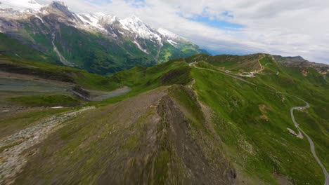 FPV-drone-proximity-flight-over-a-sharp-mountain-ridge-near-the-Grossglockner-alpine-road-in-Austria