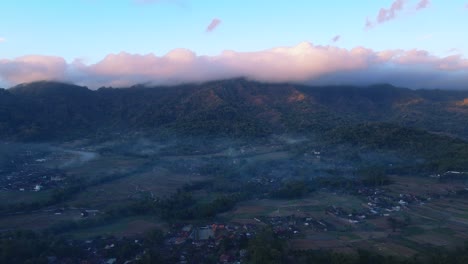 Early-morning-misty-landscape-of-Indonesia-countryside,-aerial-drone-view