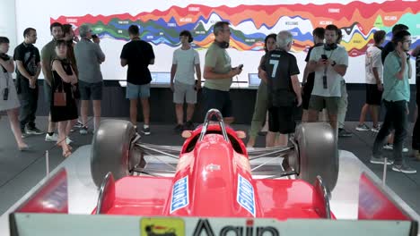 Visitors-take-photos-at-the-Ferrari-F1-F187-and-88C-exhibition-at-IFEMA-Madrid-in-Spain