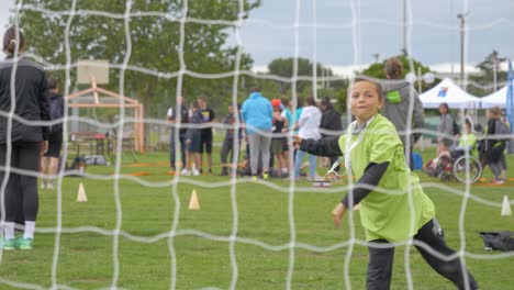 Slow-motion-shot-of-a-disabled-child-throwing-a-ball-and-celebrating-at-the-Narbonne-Handicapped-event