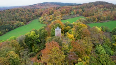 Drone-flight-around-a-small-castle-on-a-mountain-in-the-Thuringian-Forest