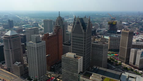 Aerial-view-overlooking-the-skyline-of-downtown-Detroit,-sunny-day-in-Michigan,-USA