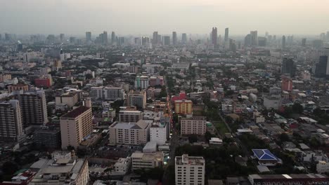 Aerial-view-of-smoggy-downtown-highrise-buildings-in-Bangkok-Thailand