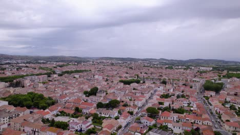 Narbonne-city-drone-view,-showcasing-the-cathedral-and-its-surroundings