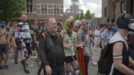Men-in-dog-costumes-dancing-and-walking-during-the-Antwerp-Pride-Parade-2023-in-Belgium