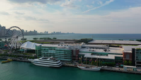 Aerial-view-flying-in-front-of-the-Navy-pier,-sunny,-summer-day-in-Chicago,-USA