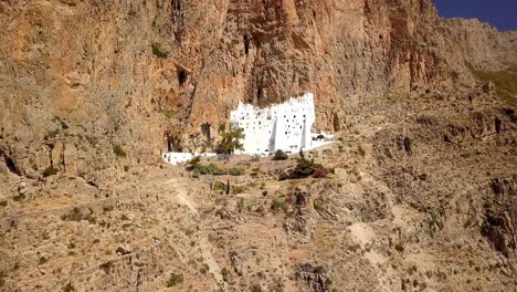 The-Panagia-Hozoviotissa-Monastery,-Standing-On-A-Rock-Over-The-Aegean-Sea-In-Amorgos,-Greece