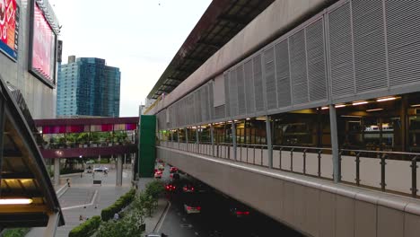 BTS-Skytrain-Station-at-Lad-Phrao-in-Bangkok,-Thailand-with-Traffic-Below