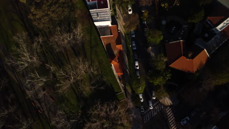Residential-building-from-above,-acute-angle-house,-orange-roof,-street,-road