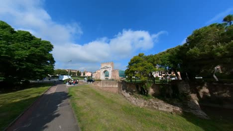 Traffic-at-the-Roundabout-near-the-Arch-of-Augustus-in-Rimini,-Italy