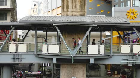 BTS-Skytrain-Walkway-at-Lad-Phrao-with-People-Walking,-Thailand