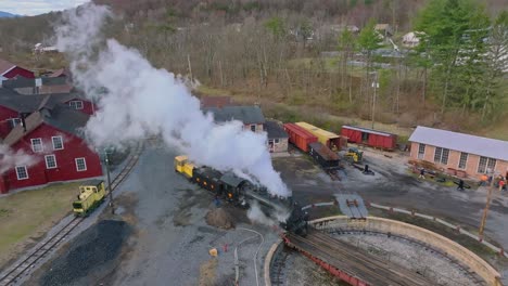 A-Drone-View-of-a-Restored-Steam-Engine-on-a-Roundtable-Blowing-Smoke-Getting-Ready-for-a-Days-Work