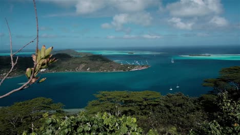 Stunning-view-over-a-sheltered-anchorage-for-yachts-in-the-tropical-and-remote-island-of-Moorea-in-the-South-Pacific