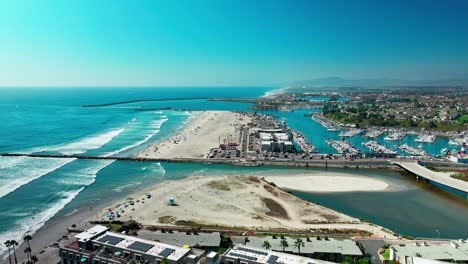 Harbor-in-Oceanside-California-flying-over-the-beach-sand-surf-bike-path-boats-and-marina,-Part-1