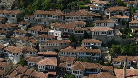 Berat-Albania,-aerial-views-of-the-urban-landscape:-close-and-orbit-aerial-view-to-the-famous-houses-with-their-houses-and-their-windows