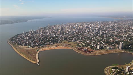 Aerial-view-of-the-coastal-city-of-Posadas-Misiones-Argentina,-densely-populated-coastal-city