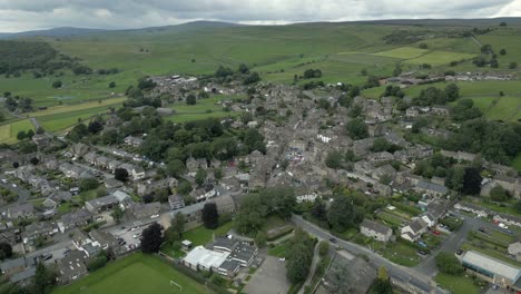 An-aerial-view-of-the-Yorkshire-town-of-Grassington-on-a-cloudy-summer-afternoon,-England,-UK