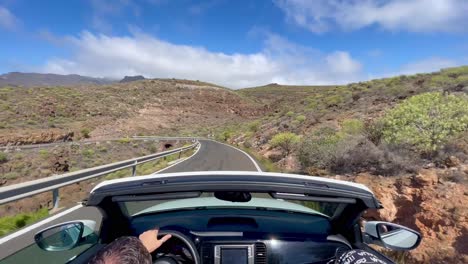 Driving-in-a-convertible-through-the-mountains-of-Gran-Canaria,-Spain